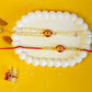 Red Eye Shape Kundan Couple Rakhi